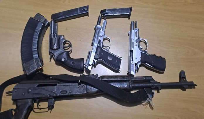 Wanted suspects nabbed with firearms